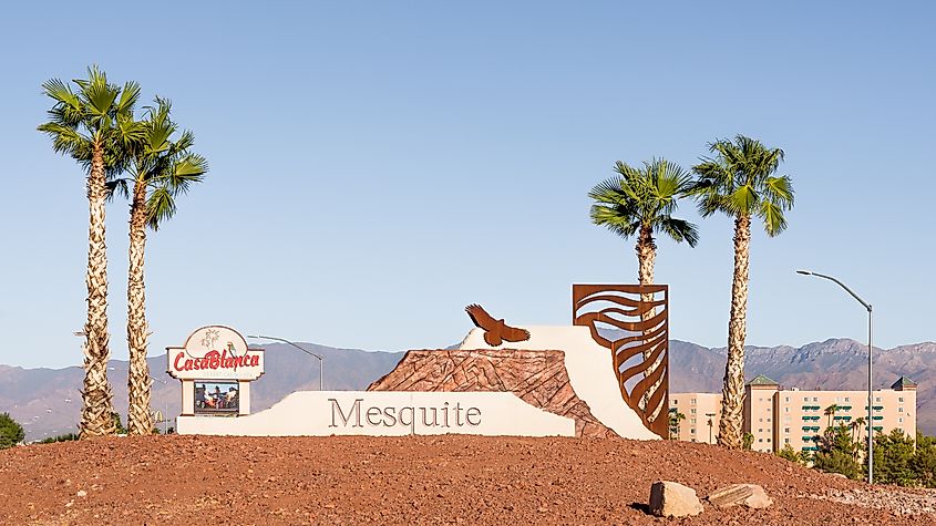 A Mesquite, Nevada, welcome sculpture and palm trees.