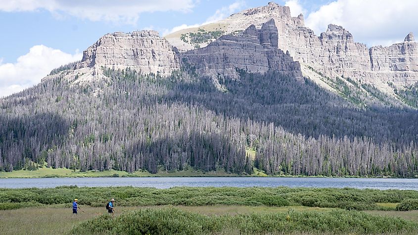 Hikers pass near Brooks Lake, Wyoming