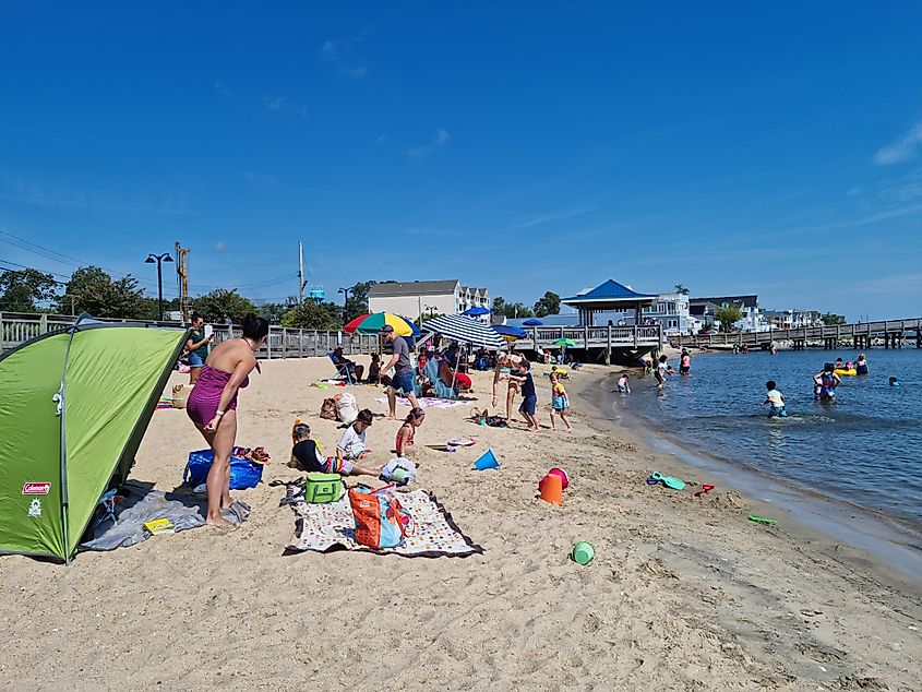 People enjoying at the beach in North Beach, Maryland.