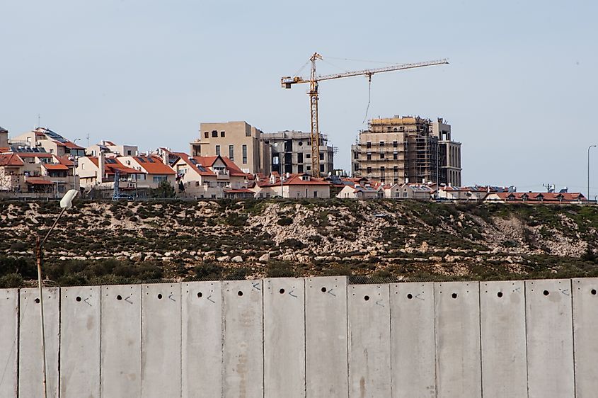 Construction in the Israeli settlement of Gilo, visible above the Israeli separation wall surrounding Bethlehem in the West Bank. 