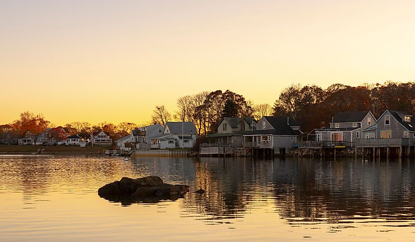 Traditional New England houses along the East River in Wareham Massachusetts at sunset