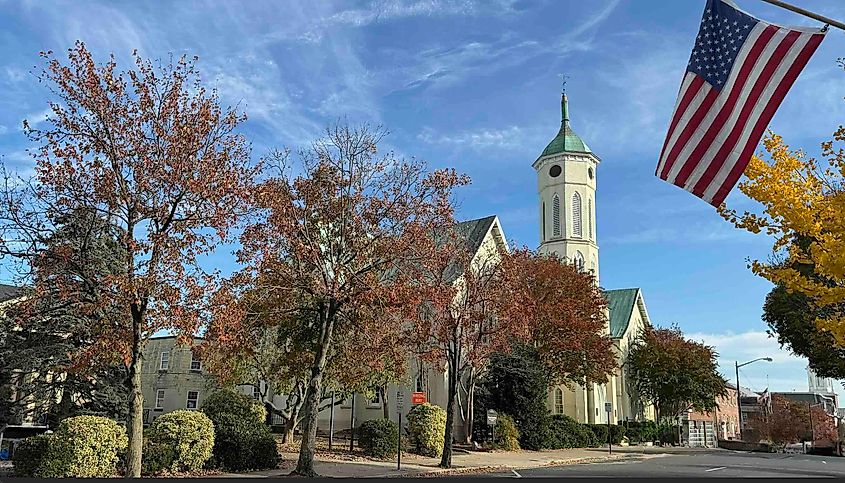 Fredericksburg Main Street with flag and Chruch by Bryan Dearsley