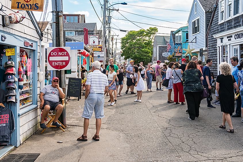 People and tourists stroll through the streets and numerous shops in Rockport, Massachusetts. Editorial credit: starmaro / Shutterstock.com