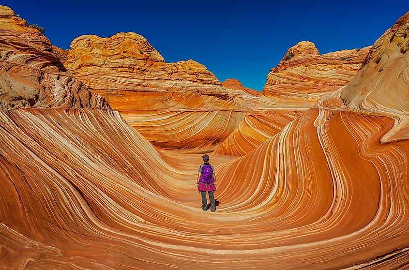 A traveller exploring The Wave, Arizona.