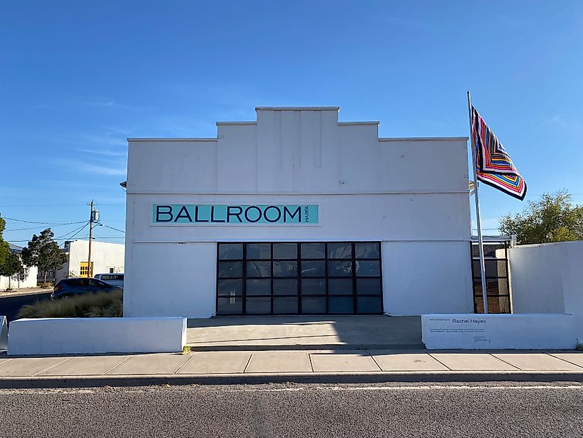 A white building with the word “Ballroom” painted in block letters. 