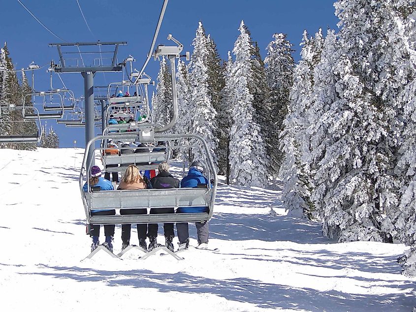 Skiers ride the chairlift in Steamboat Springs, Colorado