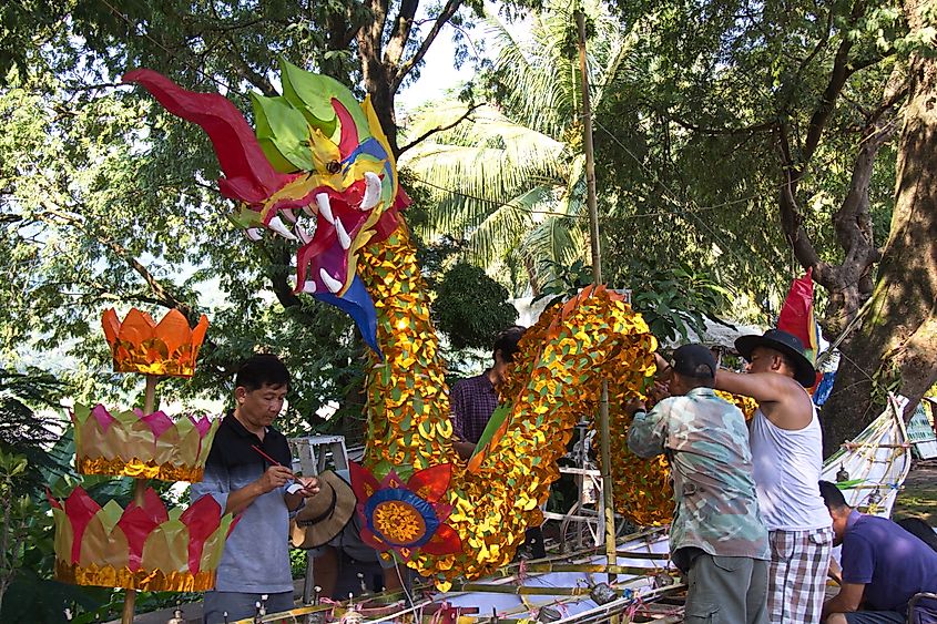 Preparing for Ok Phansa festival along the Mekong River, Luang Prabang, Laos. Image Credit ASITRAC via Wikimedia.