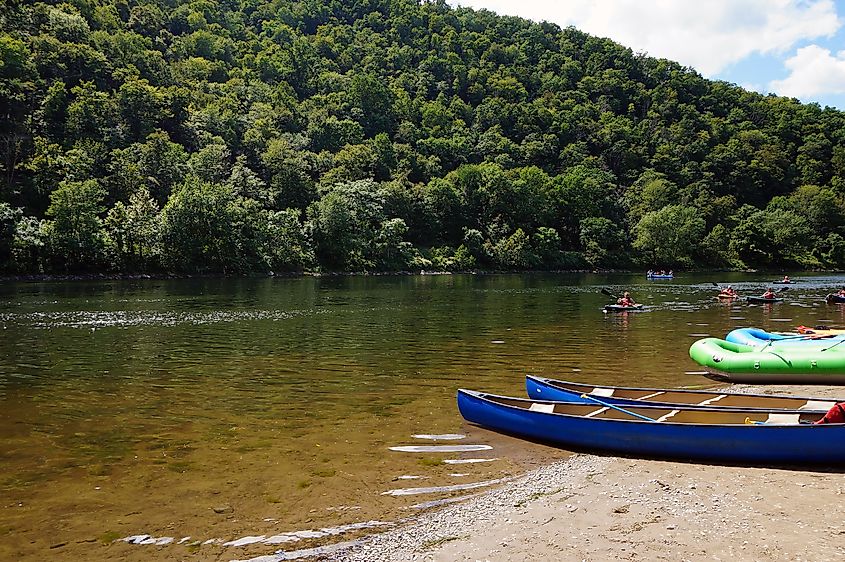 Kayakers in the Delaware River and Canoes and Rafts on the Shore at the Delaware Water Gap