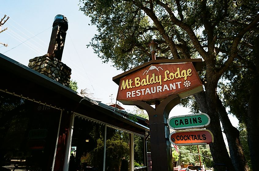 The vintage sign for the Mt. Baldy Lodge, up in the mountains. Editorial credit: Logan Bush / Shutterstock.com