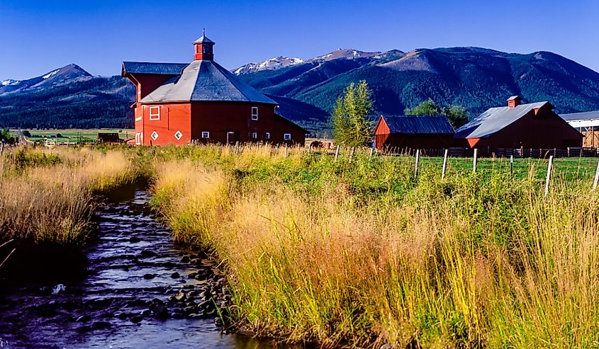 Octagonal red, round barn on a farm near Joseph, Oregon.