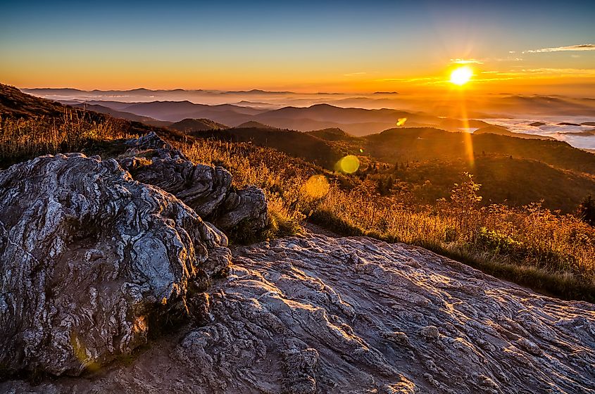 A golden fall sunrise over the Blue Ridge Mountains from atop Black Balsam Bald in North Carolina.