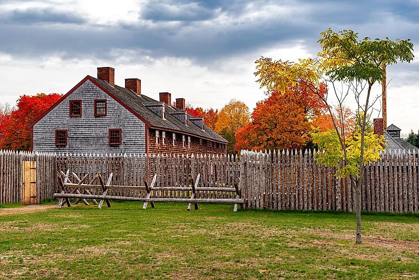 Historic Old Fort Western in Augusta, ME, on a cloudy day in Fall season.