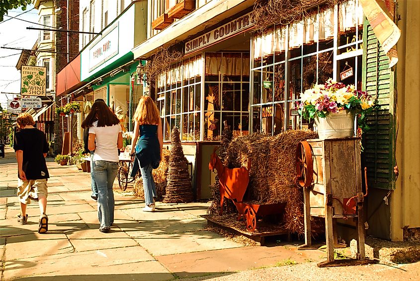People walk past a home decor store in downtown Saugerties, New York.