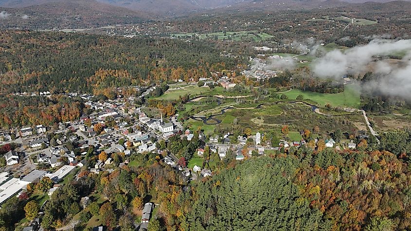 Aerial view of Shelburne, Vermont, surrounded by vibrant fall foliage