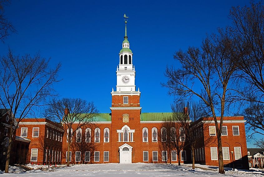 A winter view of Baker Tower, rising above Dartmouth College campus in Hanover, accentuated by the snow-covered grounds and the crisp New Hampshire air.