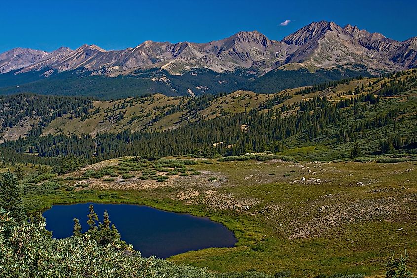 The Three Apostles above an alpine tarn near Buena Vista, Colorado.