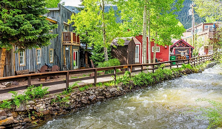 Crested Butte, Colorado village houses by Coal Creek River. Image credit Kristi Blokhin via Shutterstock