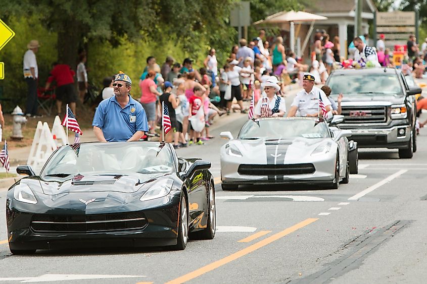 Veterans ride in convertibles along the parade route of the annual Old Soldiers Day Parade in Alpharetta
