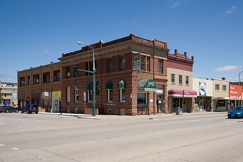 Street view of Mandan, North Dakota, featuring a blend of historic buildings and local businesses in a small-town setting.