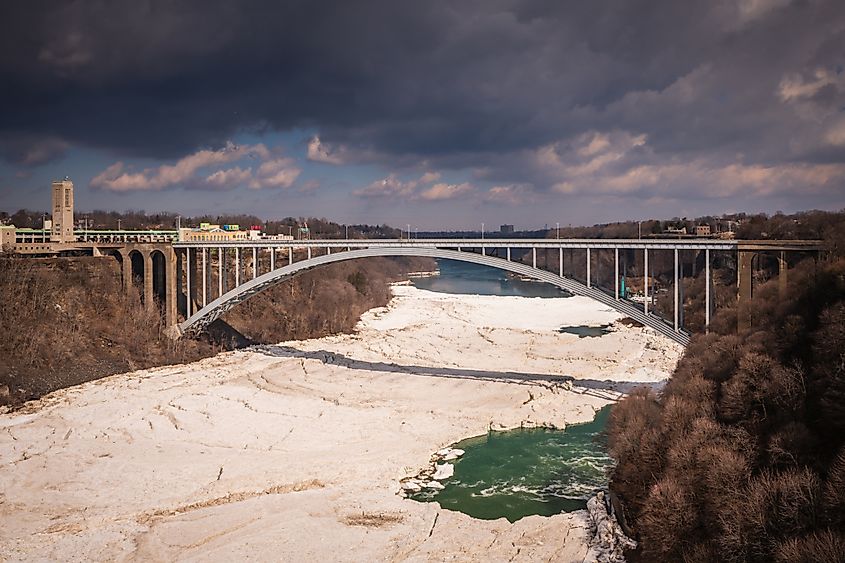 The Iconic Lewiston-Queenston Bridge in winter, with the river frozen over.
