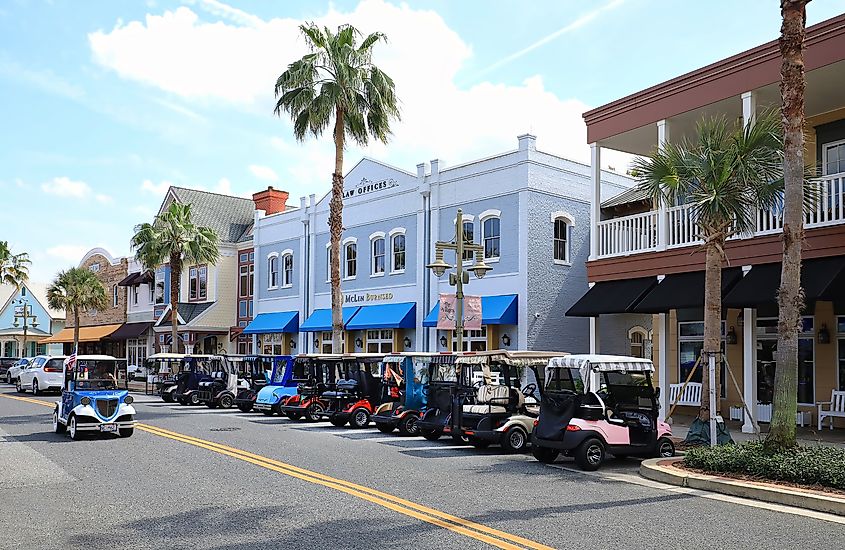 A downtown street with golf carts in The Villages in Florida.