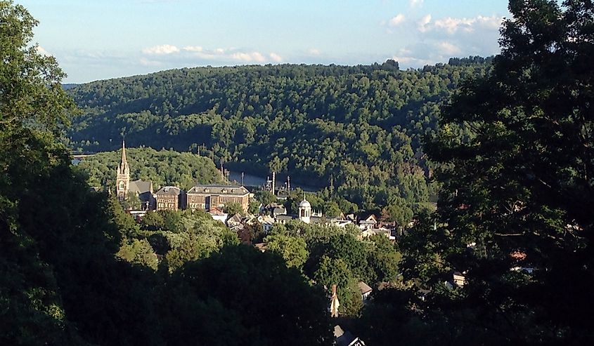 The small town of Little Falls, New York is seen from a high point over its steeples and the Erie Canal.