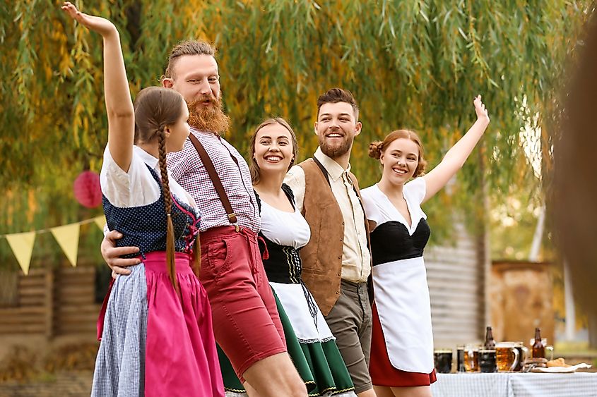 People dancing and celebrating in traditional outfits