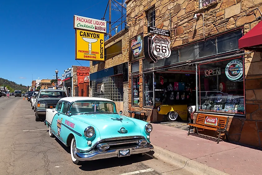 Street scene in Williams, Arizona, USA, with a classic car in front of souvenir shops, part of the famous Route 66