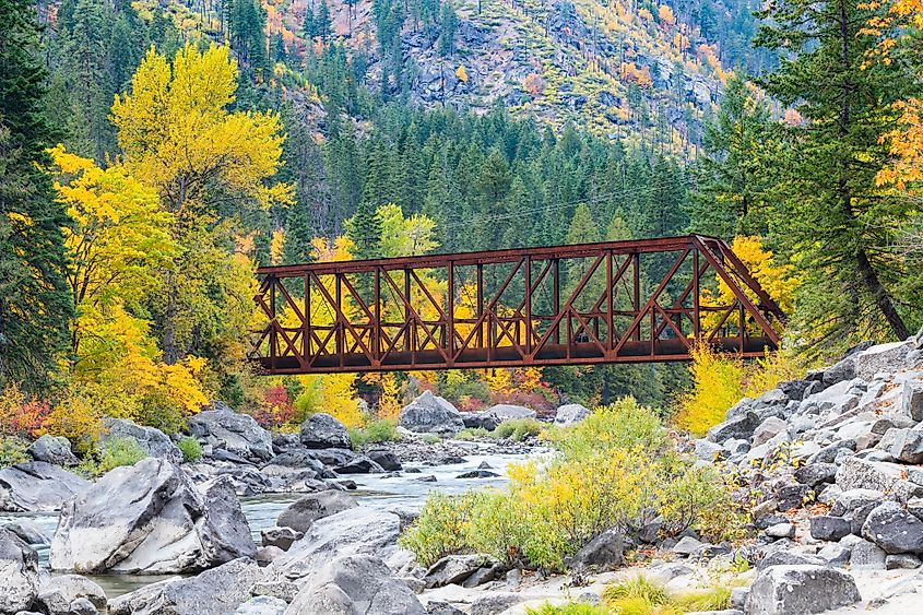 Tumwater Canyon Bridge in fall crossing the boulder strewn Wenatchee River. 