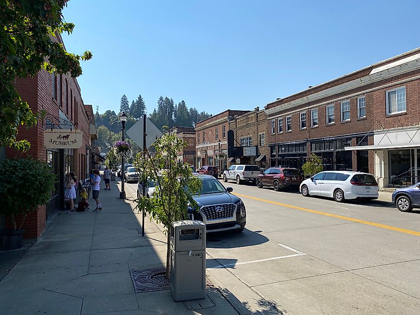 A family explores a museum on a cozy, red-brick main street in Northern Idaho.