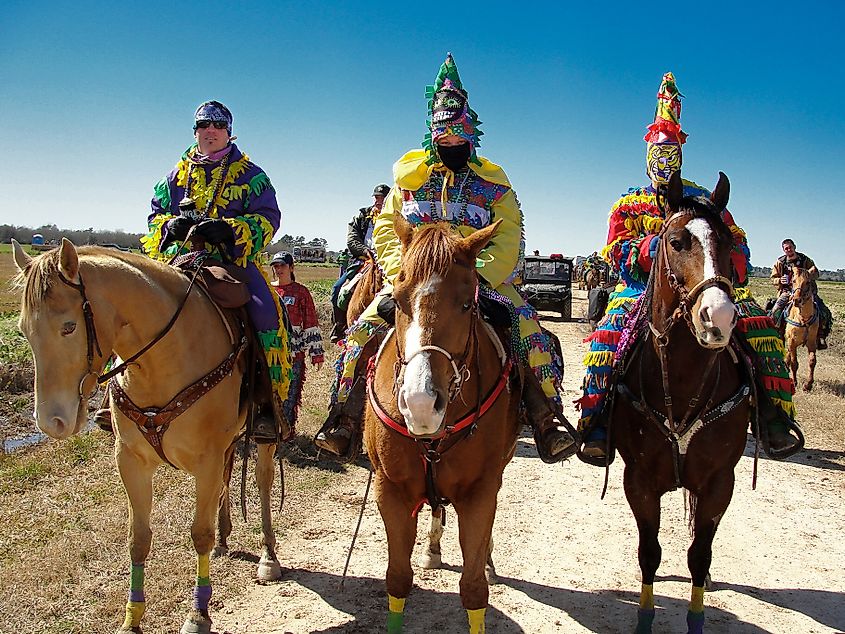 Three Cajun Mardi Gras horseback riders in Eunice, Louisiana