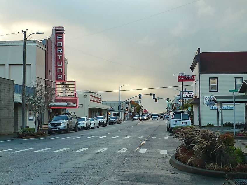 The Fortuna Theater with only part of its neon lit and the wider view of Main Street in Fortuna, California.