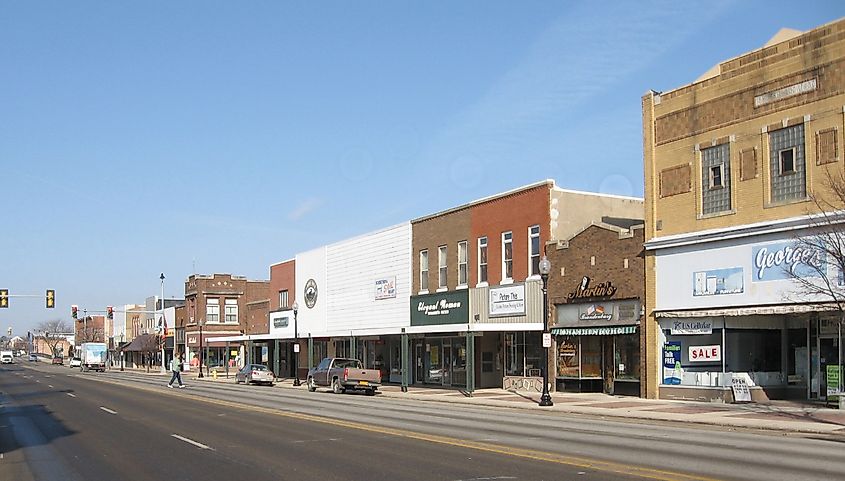 Street view of Waverly, Iowa, with storefronts and sidewalks lining the road.