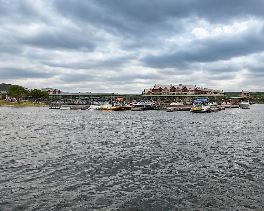 View of the marina and boat dock at Possum Kingdom Lake, Texas, on a cloudy day.