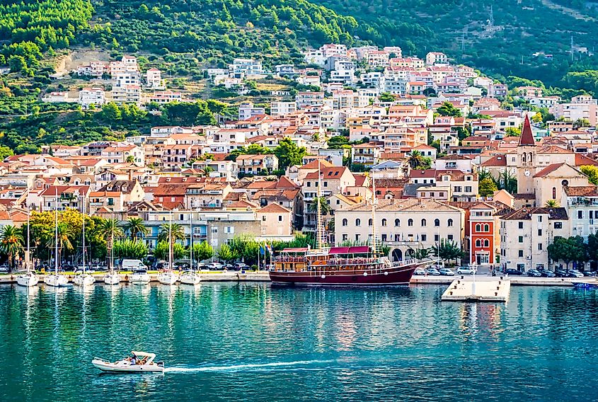 Panoramic view of Makarska, Croatia, with the harbor, boats, and blue Adriatic Sea along the Dalmatian coast