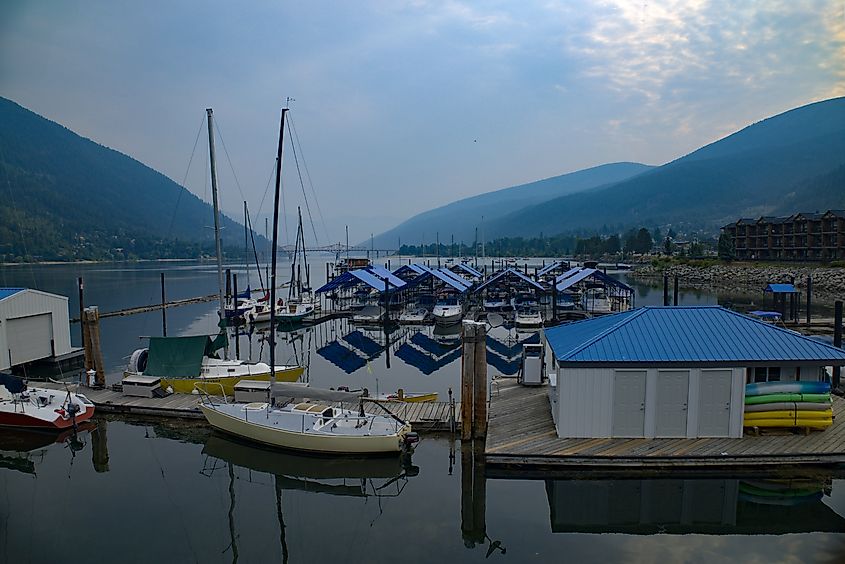 The boat docks on Kootenay Lake, with Nelson's Big Orange Bridge in the background and downtown Nelson located just the right.