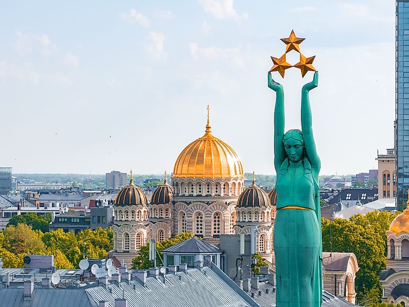 Aerial view of the Freedom Monument and Riga Dome Cathedral in Riga, Latvia. Image Credit Aerial Film Studio via Shutterstock.