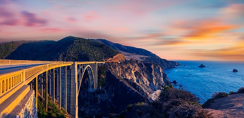 Bixby Creek Bridge (Rocky Creek Bridge) and Pacific Coast Highway at sunset near Big Sur, California, USA.