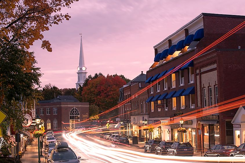 Traffic on High Street in downtown Camden at dusk, Maine