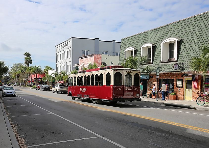 A trolley stops to pick up passengers on Donnelly Street for a tour of Mount Dora, Florida.