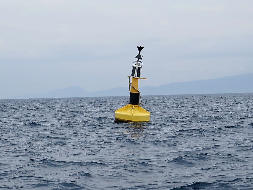 A weather buoy floating on the surface of the sea