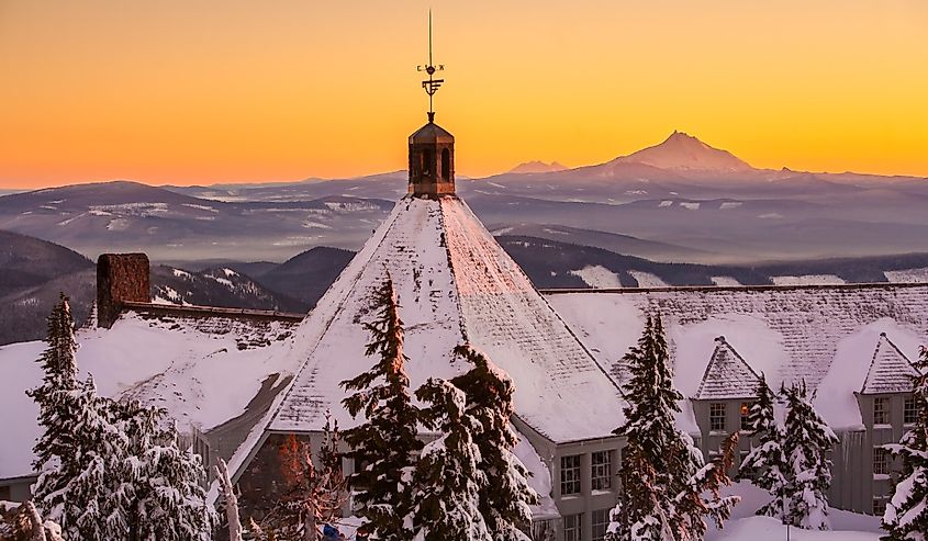 Timberline lodge on Mt Hood with Mt Jefferson in background, with warm light just after sunset, Oregon, Mt Hood National Forest.