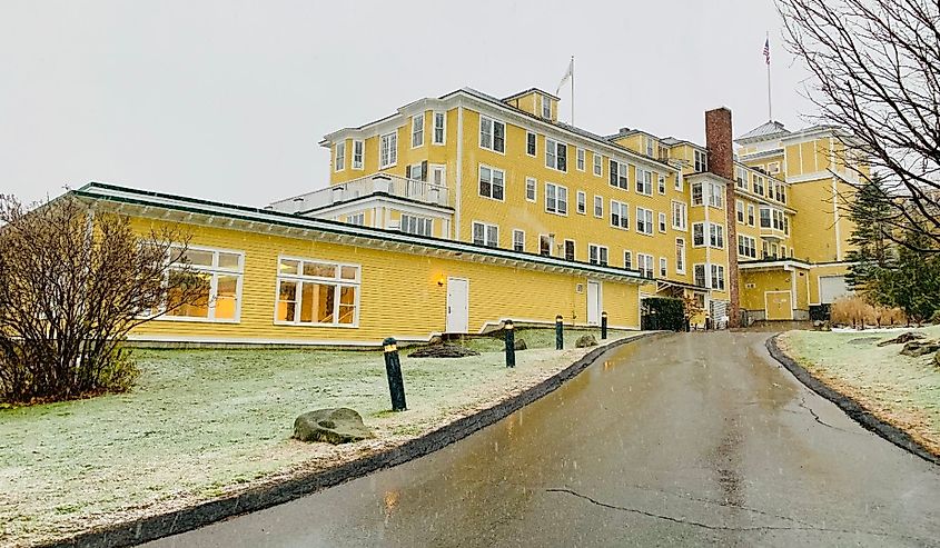 A dusting of snow graces the lawn at the back entrance to the historic Mountain View Grand Resort and Spa, Whitefield, New Hampshire.