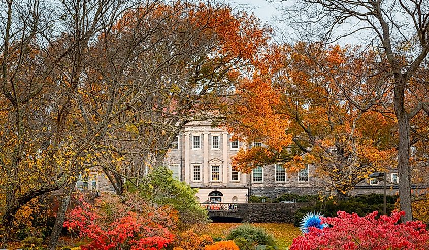 Cheekwood Estate mansion building architecture surrounded by colorful fall foliage trees near Nashville, Tennessee.