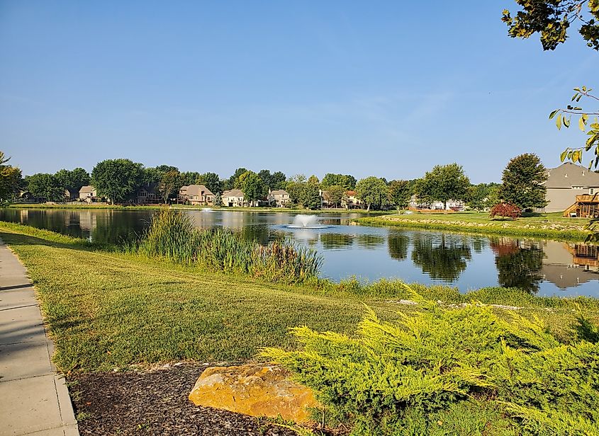 Fountain in the nearby Duck Pond at Raintree Lake.