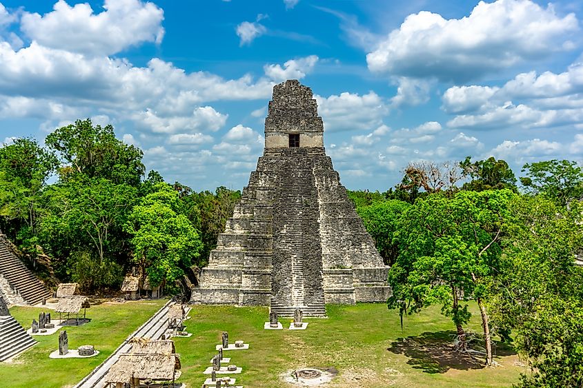 The majestic Pyramid of Tikal rises from the Guatemalan jungle, showcasing ancient Mayan architecture, rich history, and breathtaking views in a UNESCO World Heritage Site.