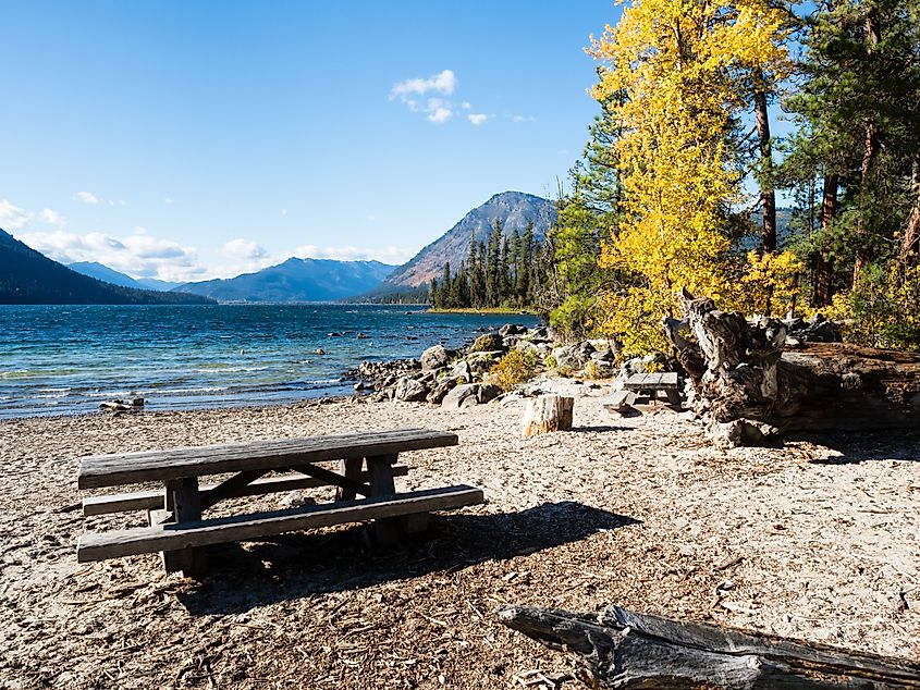 Brilliant fall foliage lines the banks of Lake Wenatchee in Washington State.