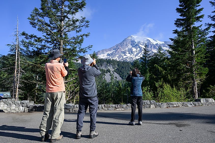 People taking photos of Mt Rainier, Washington.