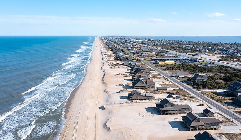 Aerial perspective of Nags Head, North Carolina, looking southwards, showcasing the town's layout and coastal line along the Atlantic Ocean.