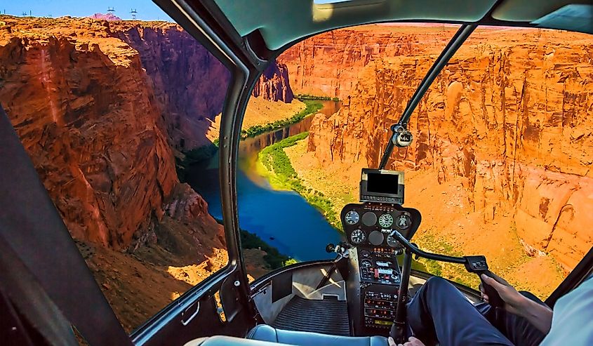 Helicopter cockpit with pilot arm and control console inside the cabin on the Grand Canyon Lake Powell. Reserve on the Colorado River, straddling the border between Utah and Arizona.